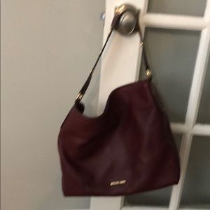 Michael Kors wine colored hand bag - like new